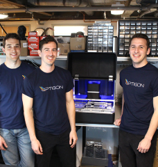 Optigon co-founders (from left to right) Brandon Motes, Dane deQuilettes, and Anthony Troupe stand with a benchtop version of the measurement tool they believe will help accelerate the pace of solar power and other clean energy products. 