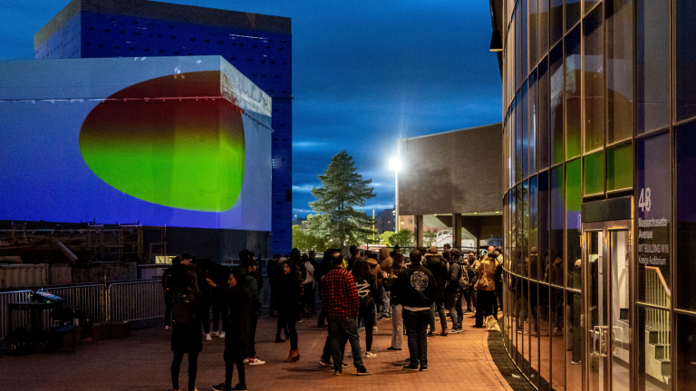 Onlookers gathered at the site of the interactive Climate Machine art installation on April 19.