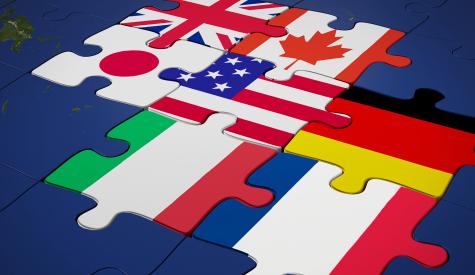G7 nation flags interlocked as puzzle pieces