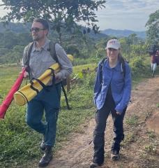Sean Anklam (left), Marcela Angel, and a team from Corpoamazonia in the mountains outside Mocoa, Colombia, make their way to deploy an unpioloted aerial vehicle on a test flight.